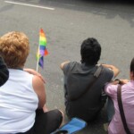 She whacked the guy with the flag. They moved. So much for tolerance!