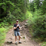 Jeff showing off just how root-covered the trail was.