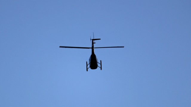 Whirlybird flying over the Coquitlam River Whirlybird flying over the Coquitlam River