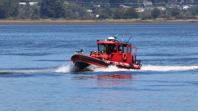 A tour boat running past Blackie Spit.